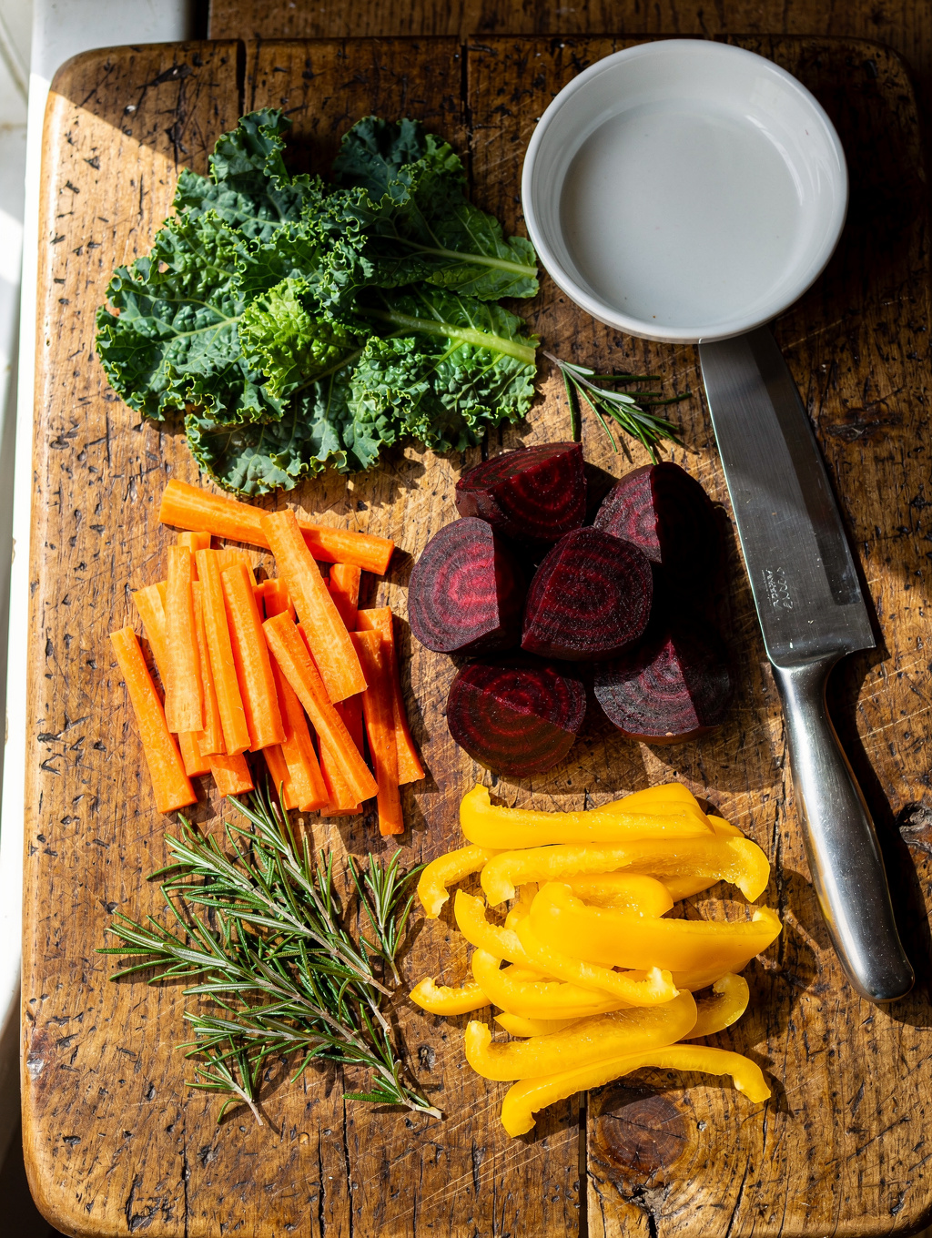A vibrant selection of fresh, organic seasonal produce captured in soft morning light